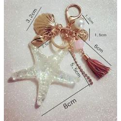 Chaveiro com estrelas-peixe e pérolas