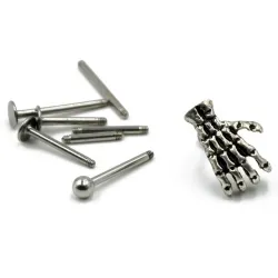 Body piercing with skull handEarrings