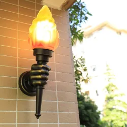 Retro hand with torch - wall lampWall lights