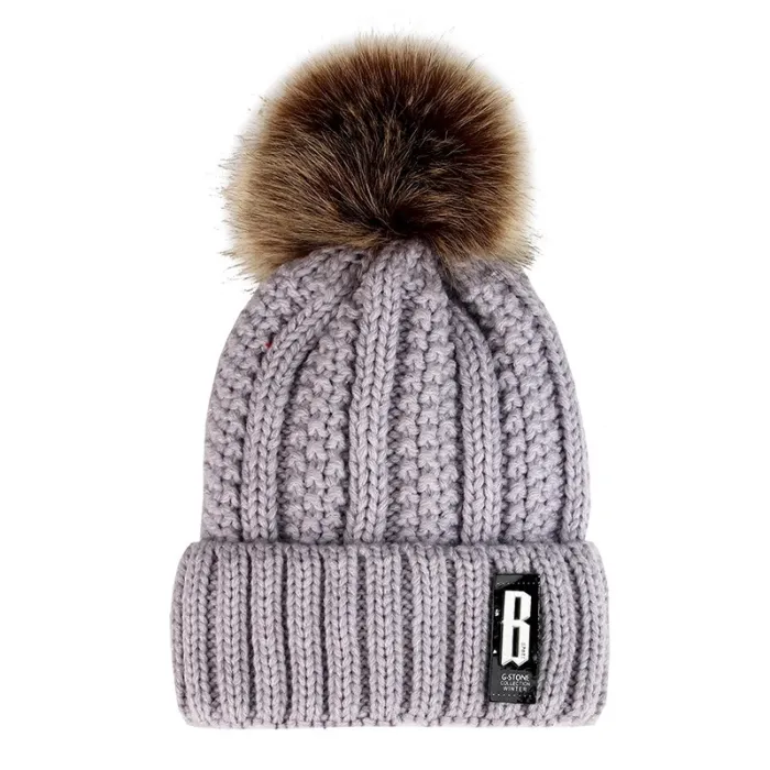 Warm winter wool hat with pom pom