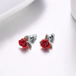 Gold stud earrings with red rose