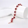 Pulseira de ouro e prata com rosas vermelhas