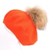 Elegante berretto con pelliccia pom-pom